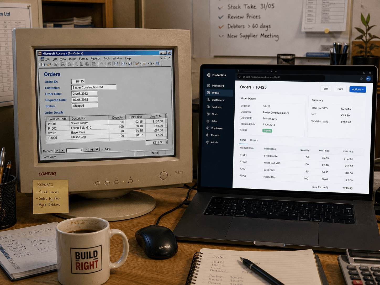 A side-by-side desk setup with a vintage Microsoft Access database on one screen and the modern Laravel rebuild on the other.